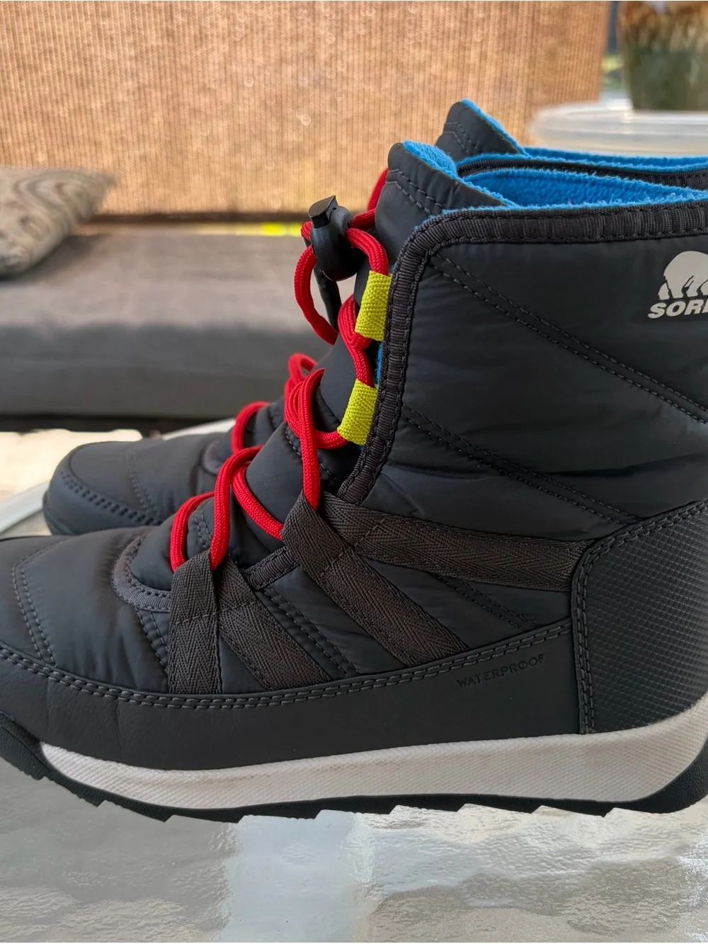 Sorel Kids Black Winter Boots with Red Laces and Blue Lining
